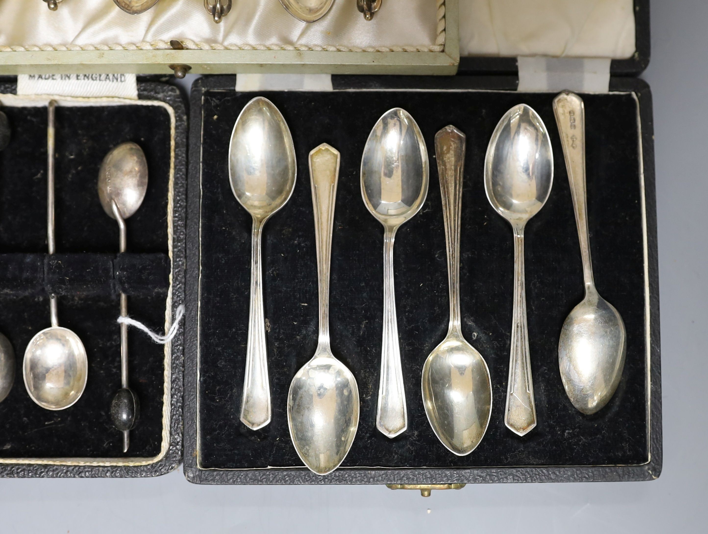 Two cased sets of six silver coffee spoons and a similar Danish sterling set.
